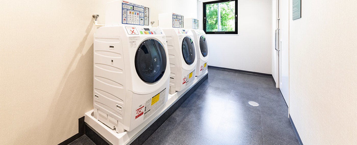 ชั้น 2 เครื่องซักผ้าหยอดเหรียญ