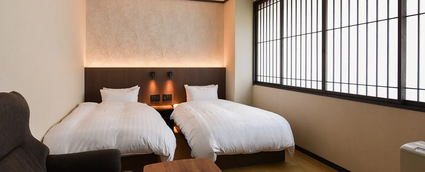 ห้องพักเตียงคู่สไตล์ตะวันตก (พร้อมห้องน้ำในตัว)