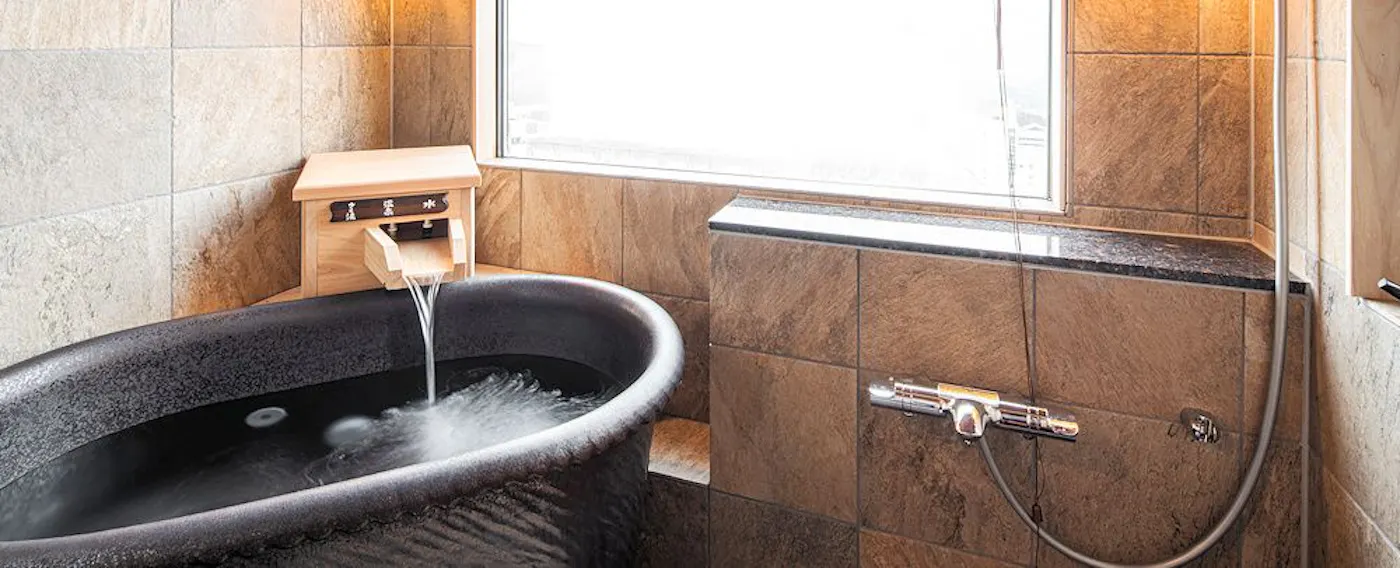 ห้องพักชั้นบนสุดพร้อมน้ำพุร้อน