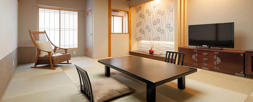 ห้องพักชั้นบนสุดพร้อมน้ำพุร้อน