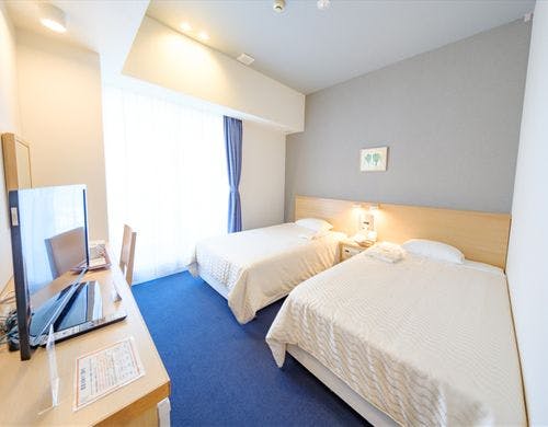 18.3m2の空間に120cm幅のベッド2台を配置