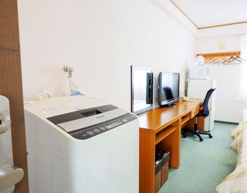 全ての客室に洗濯機を設置し便利