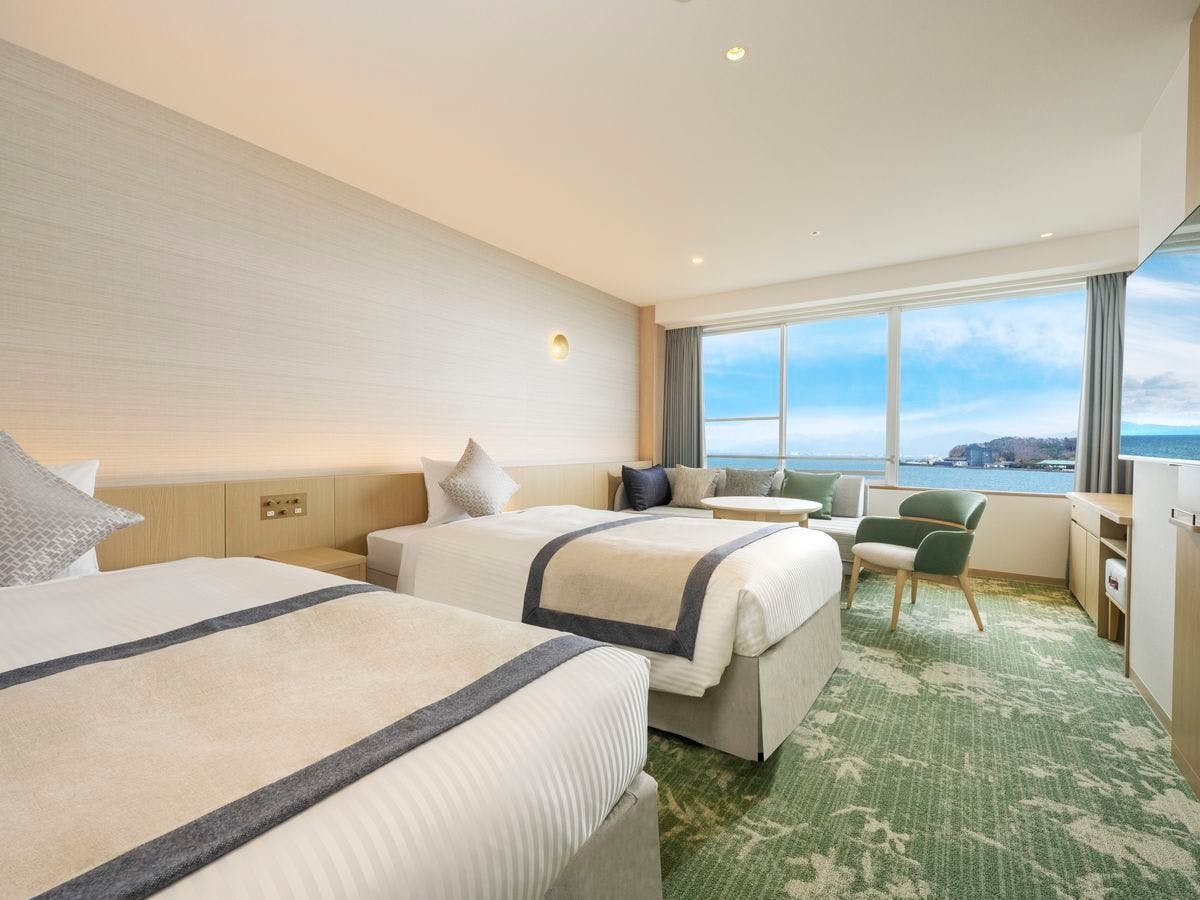 Bilik Deluxe Twin dengan tab mandi pemandangan