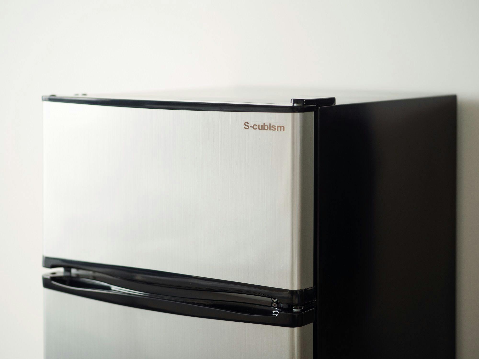 Refrigerator. The interior is empty.