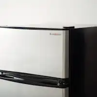 Refrigerator. The interior is empty.