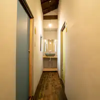 Second-floor hallway. Asagi gray on the left, Rikyu gray on the right.