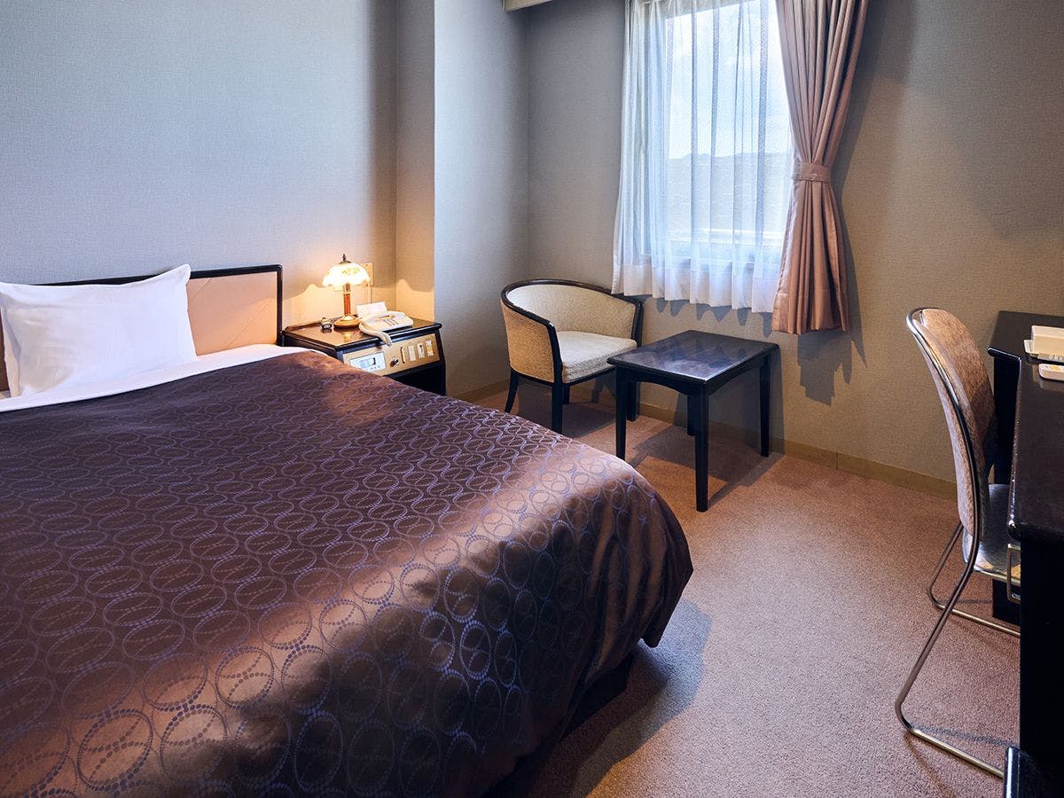 15 m² / Tempat Tidur Semi-Double