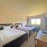 ห้องเตียงคู่วิวสวน มีโซฟาเบด