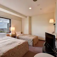 *Kamar Twin dengan 2 tempat tidur.