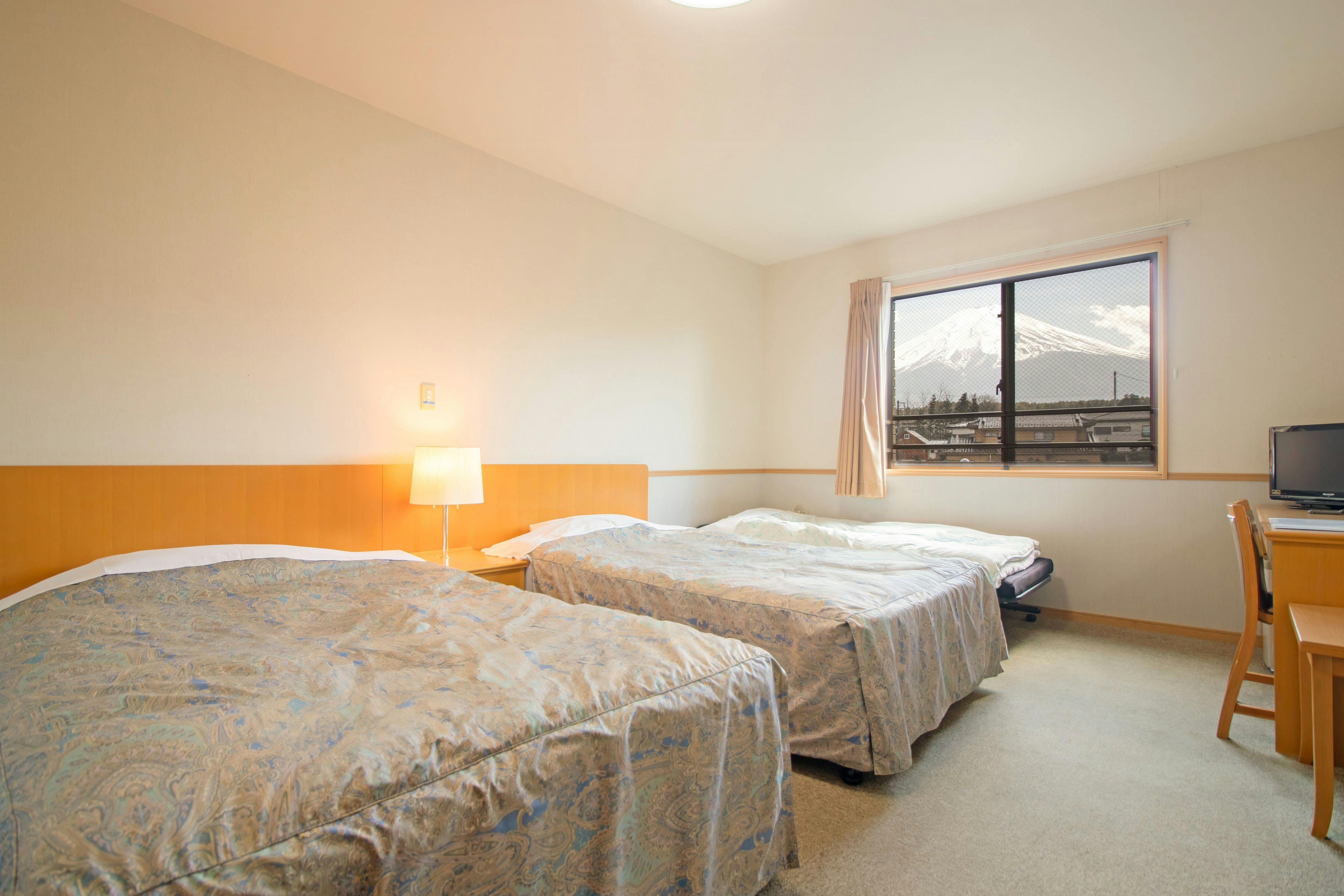 Spacious semi-double room—comfortable even for a group of three.