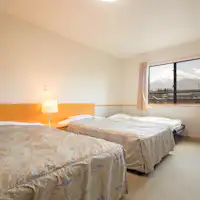 Spacious semi-double room—comfortable even for a group of three.