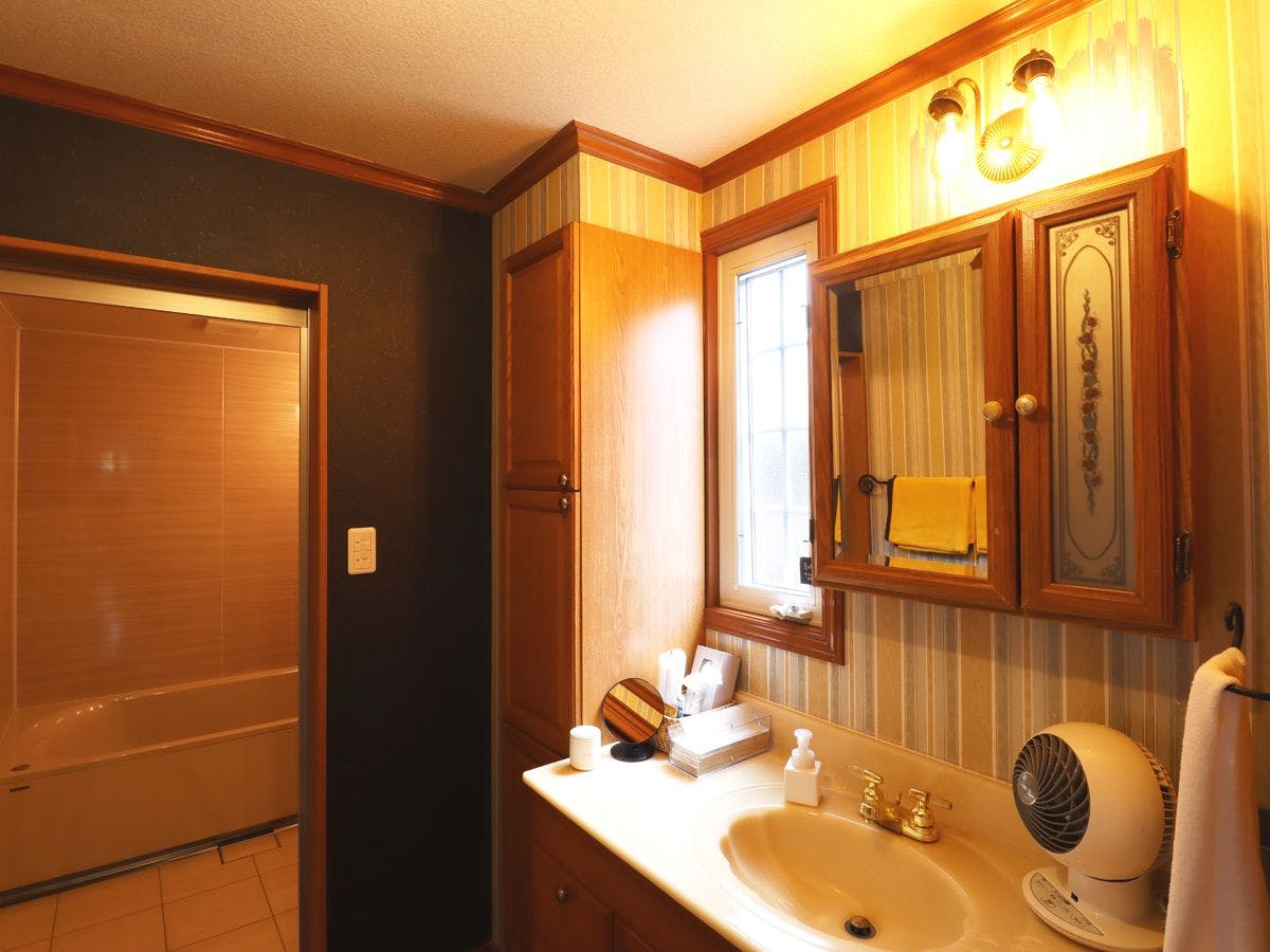 Enjoy peace of mind with a separate vanity and a bathroom with a bathtub.