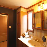 Enjoy peace of mind with a separate vanity and a bathroom with a bathtub.