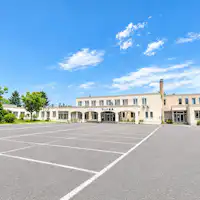A spacious parking lot that can accommodate large vehicles.