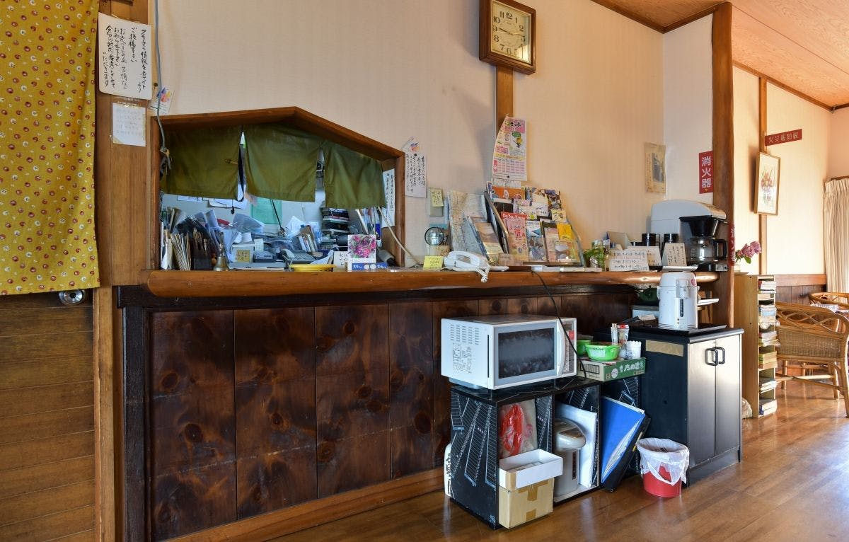 *[Inside the Building (Front Desk)]
