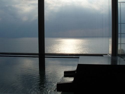 Beyond the Onsen's large bath lies the vast ocean