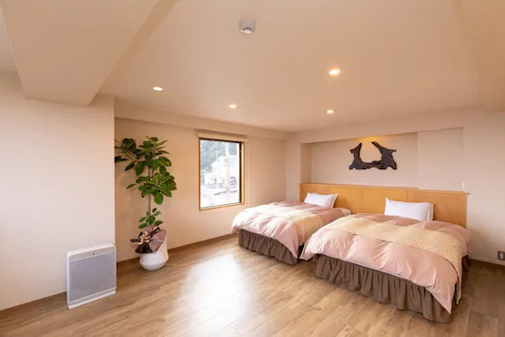 ห้องพักเตียงคู่พร้อมอ่างอาบน้ำในตัว