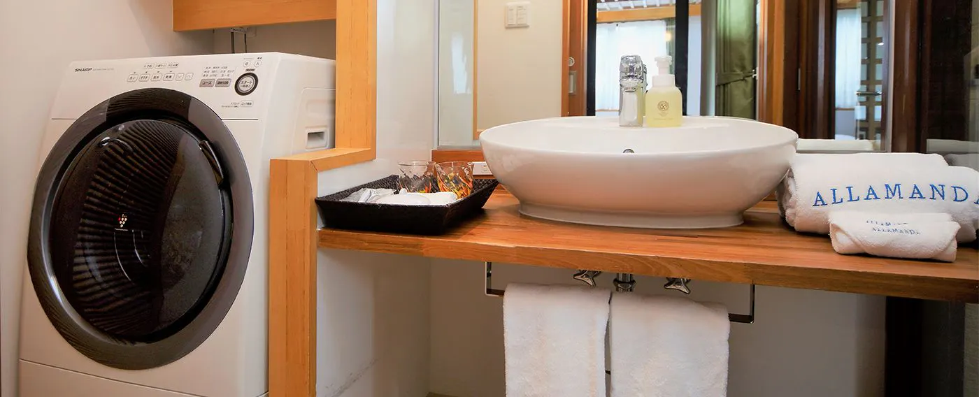 【客室設備】中期滞在などに便利な全自動洗濯乾燥機付