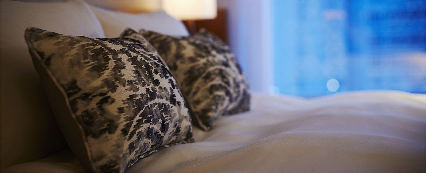 Smooth bed sheets invite you to a blissful sleep.